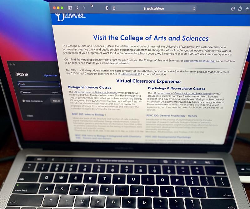 A computer screen shows the webpage where students can register for a virtual classroom visit opportunity